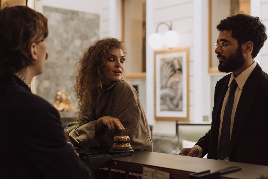 Guests checking in at an elegant hotel reception desk